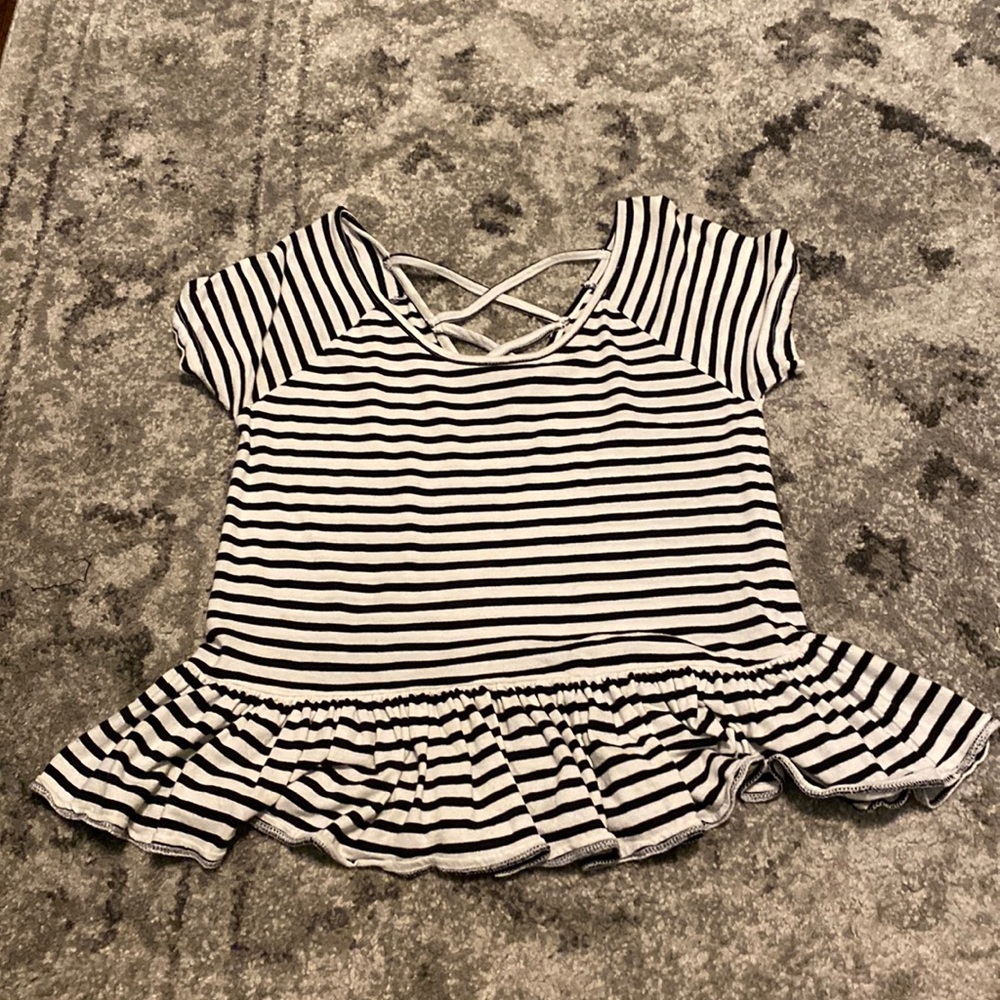 black and white striped top with ruffles on bottom